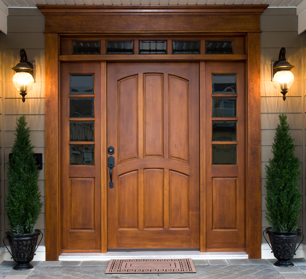 Stained Front Wood Door With Decorative Sidelights And Transom