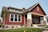 Red craftsman style house with red lap siding