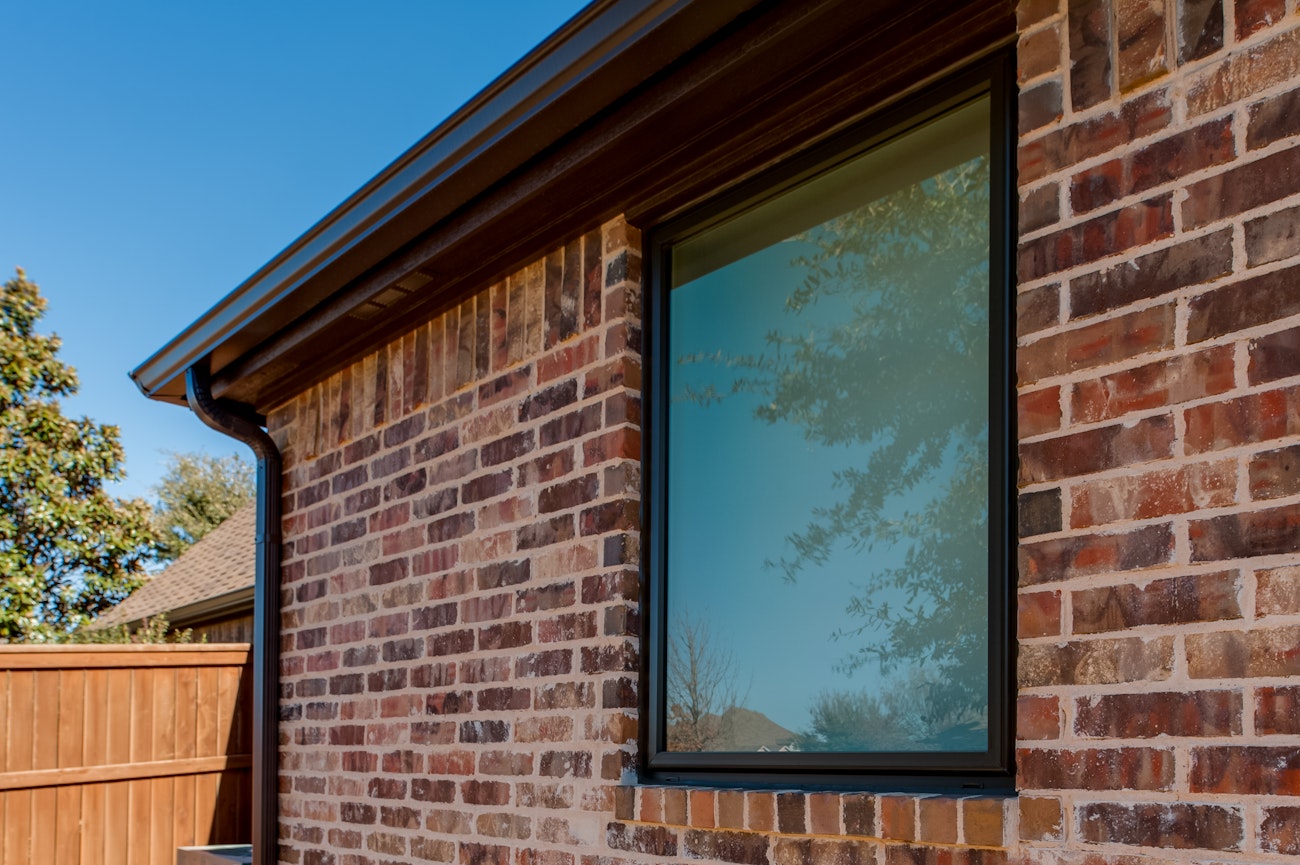 Brennan Traditions Bronze and White Windows With Prairie Grids