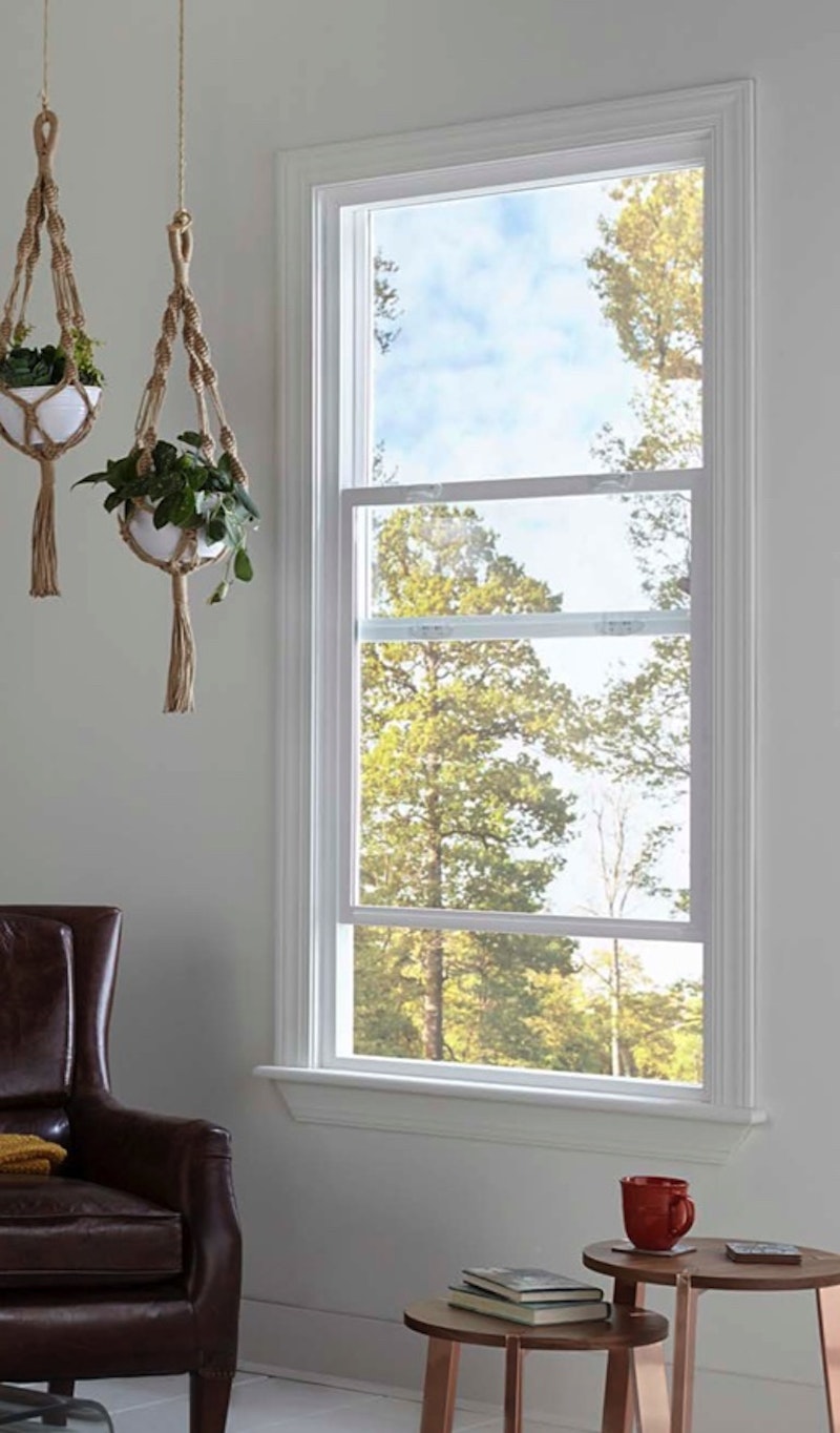 Interior view of Jeld Wen Premium Vinyl single hung window with lifted sash and two visible style cam locks.