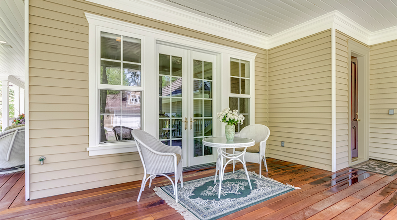 Or trim around the door matching the siding? Original photo from Adobe Stock.