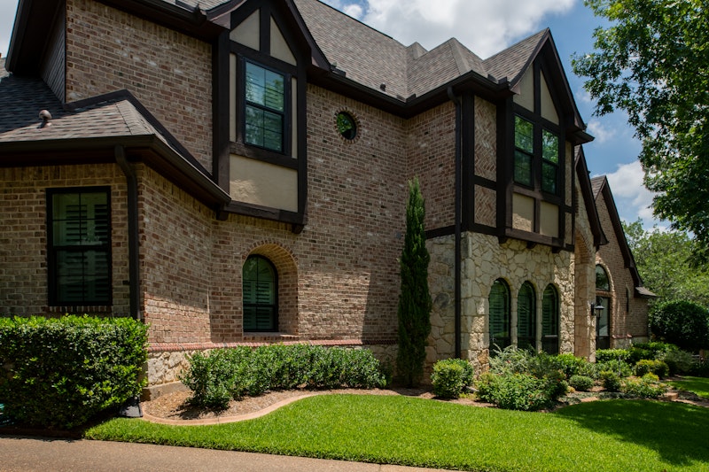 Windows Shown: Black Vinyl Brennan Traditions Windows – Double-Hung and Speciality Shapes